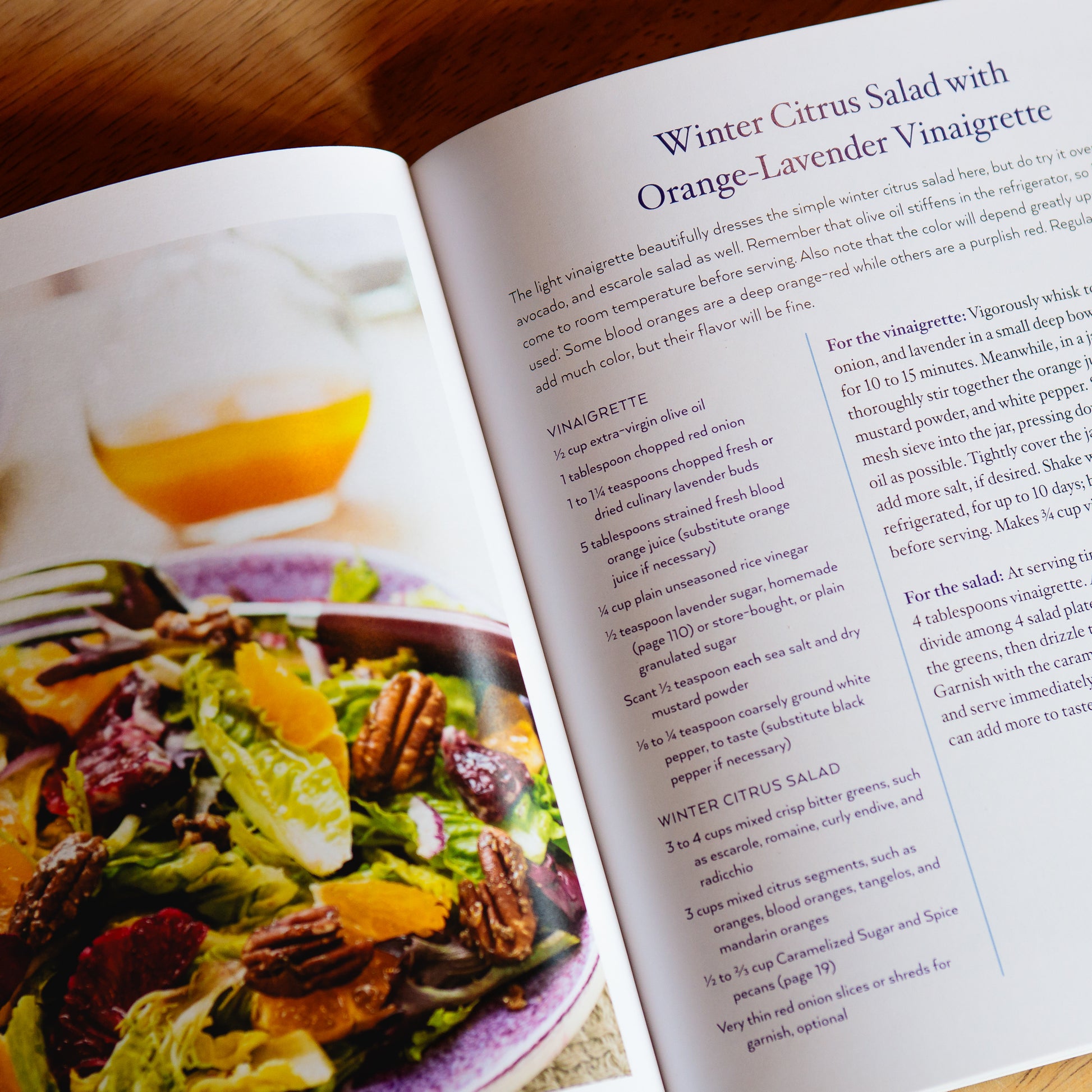 Open page of 'The Art of Cooking with Lavender' by Nancy Baggett featuring Winter Citrus Salad with an Orange-Lavender Vinaigrette.