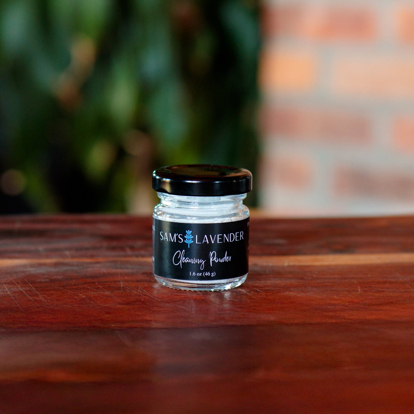 Mini glass jar of Sam's Cleaning Powder