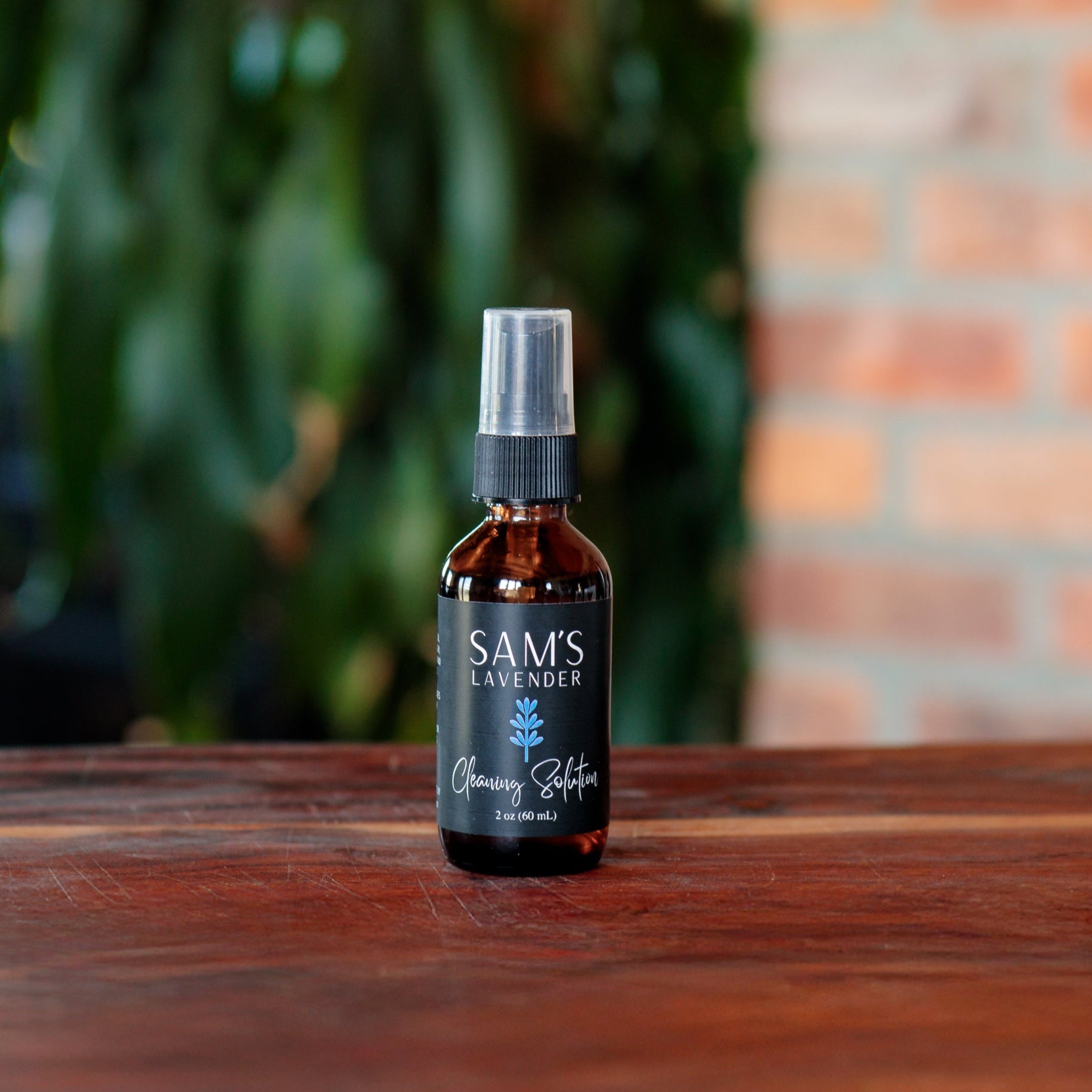 Small glass 2oz bottle of Sam's cleaning solution