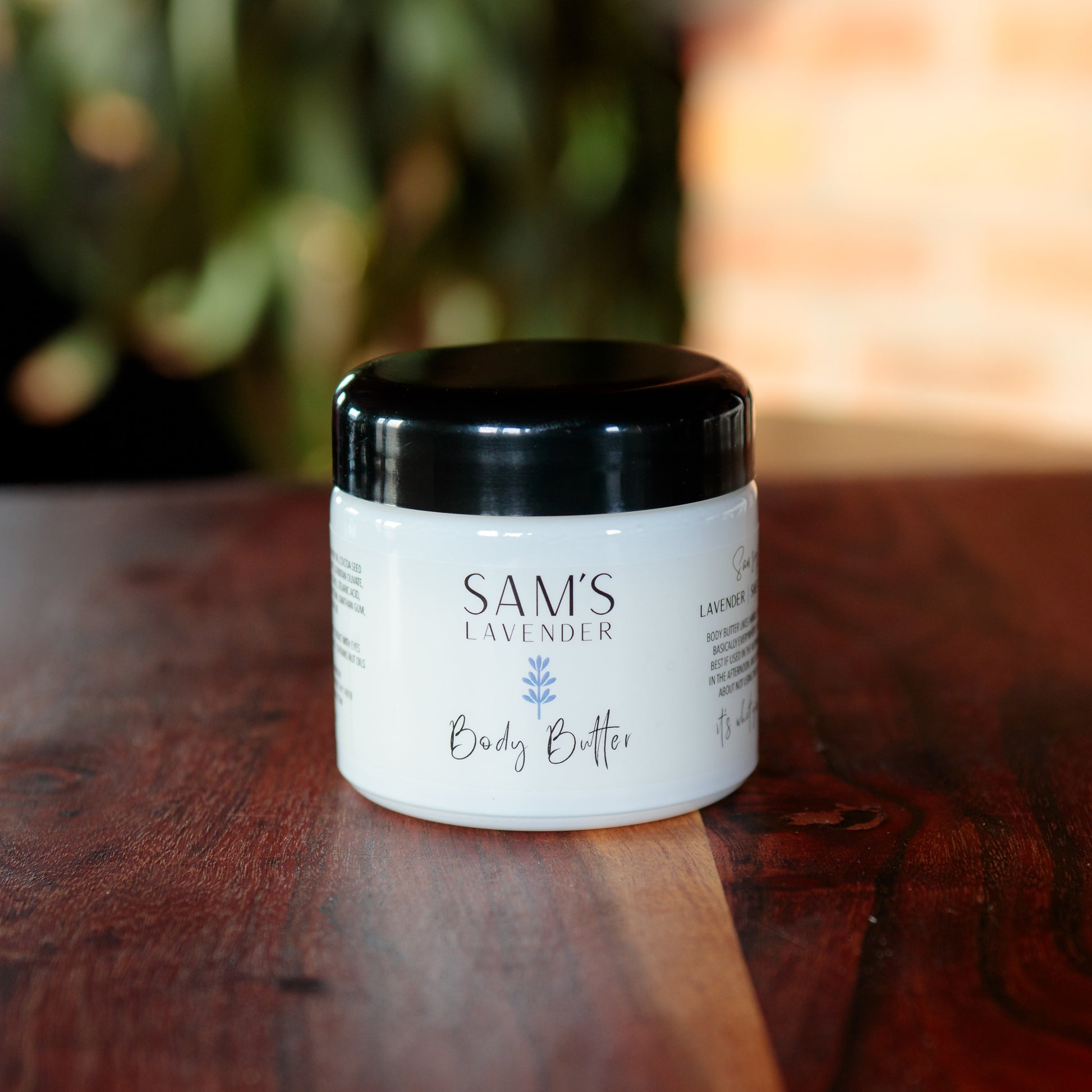 Jar of Sam's Lavender Body Butter with the lid one
