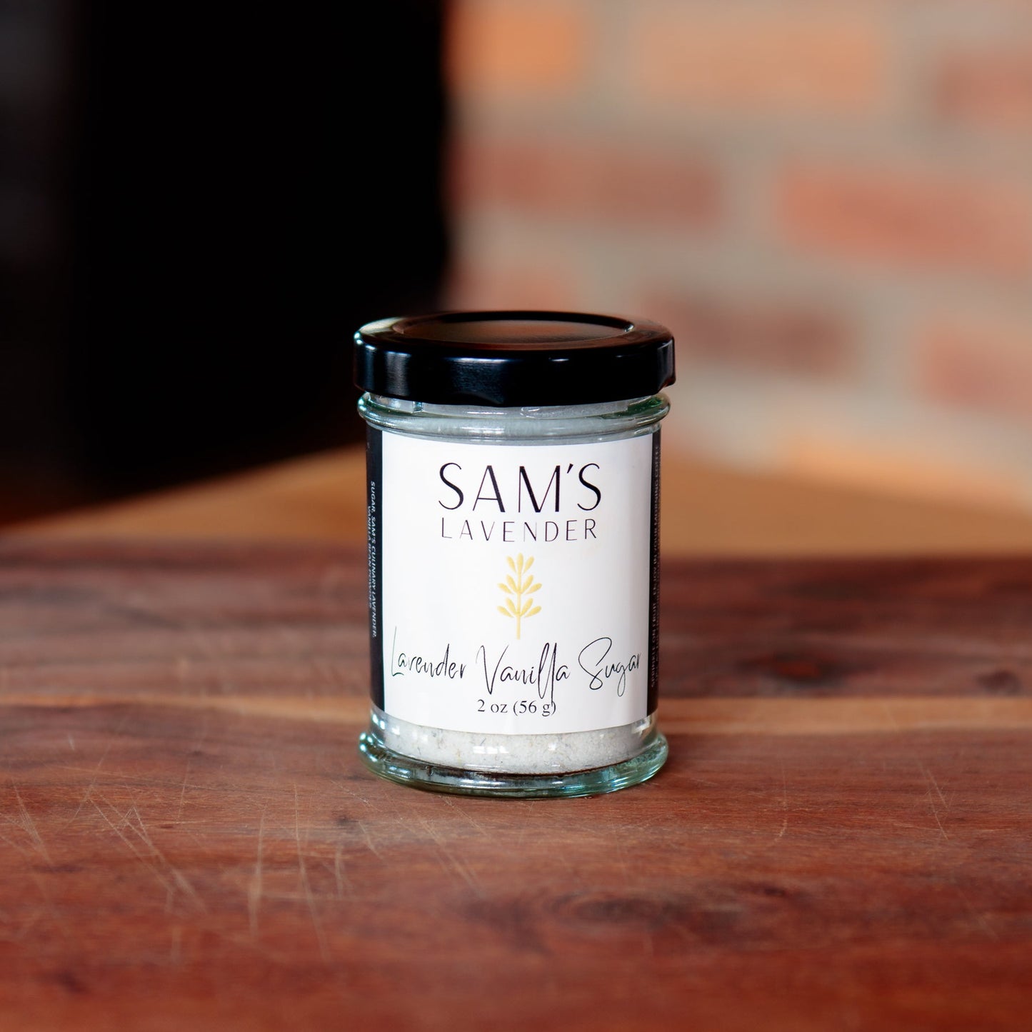 glass jar labeled "Sam's Lavender Lavender Vanilla Sugar" with a black cap
